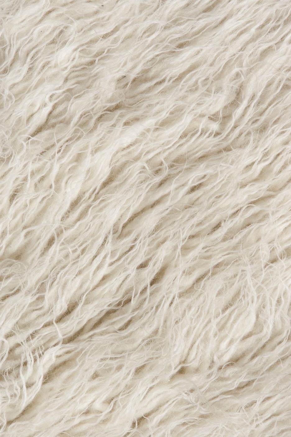 Close-up of natural wool rug fibers showing dense pile and texture detail Image Title Attribute: Wool Fiber Structure Detail