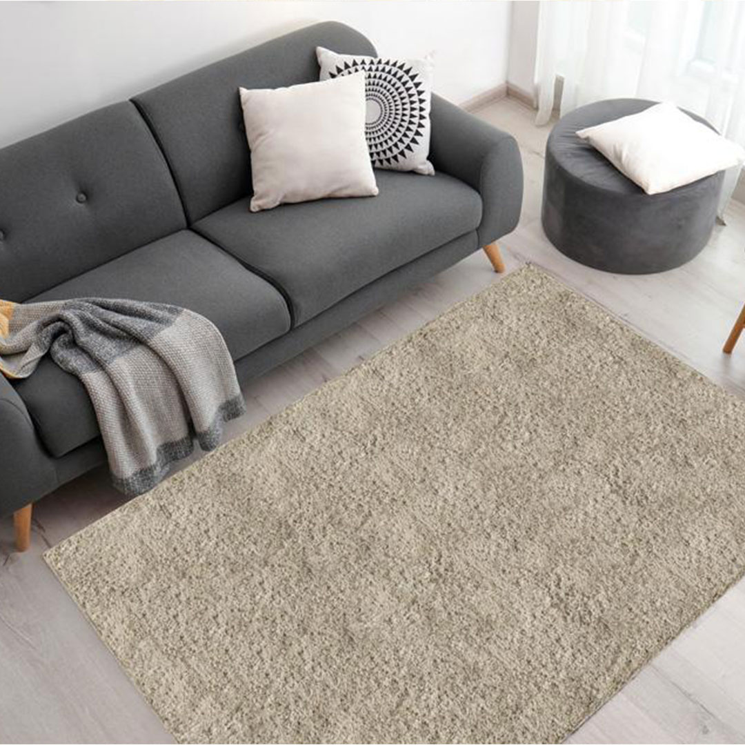 beige rug with dark gray sofa