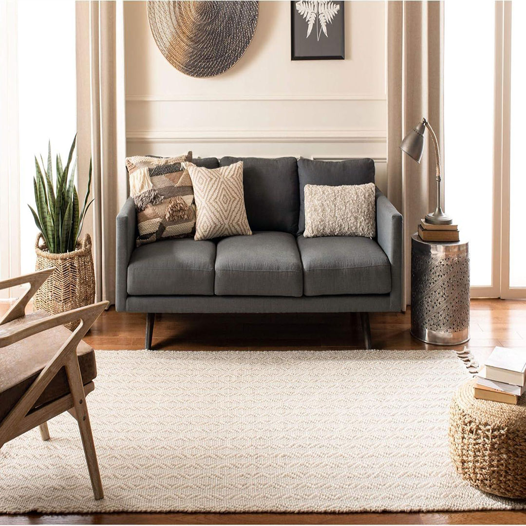 beige rug with dark gray sofa